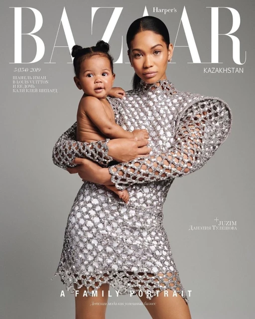 Harper's Bazaar cover with Chanel Iman holding a baby, both in stylish outfits, against a solid grey backdrop. Family portrait.