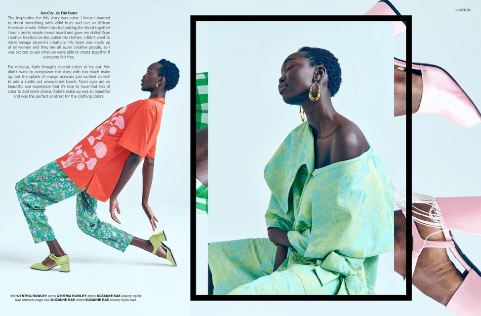 Fashion editorial shot featuring two African American women in colorful clothing posing in a photo studio setting with artificial lighting.