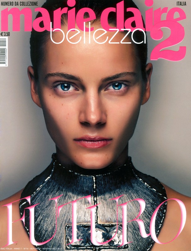 Marie Claire Italia magazine cover featuring a model with blue eyes and a metallic futuristic collar.
