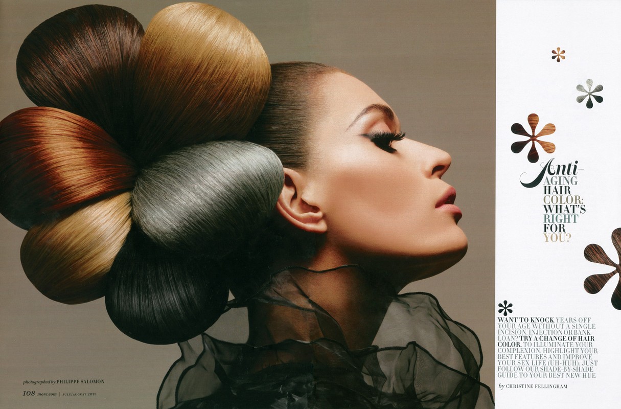 Profile portrait of a woman with a flower-shaped updo of different colored hair extensions for a hair color advertisement.