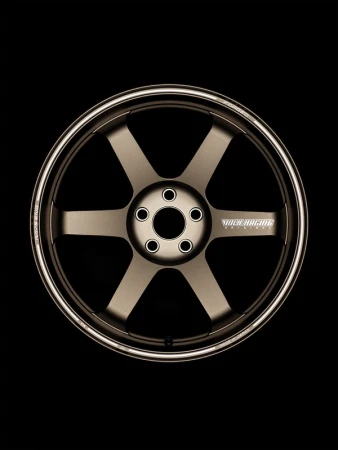 Bronze-toned six-spoke car wheel with silver rim on black backdrop, automotive part, transportation design, aftermarket car product photography.