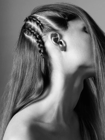Monochrome close-up portrait of a model featuring intricate side braids styled by Kenna in Los Angeles
