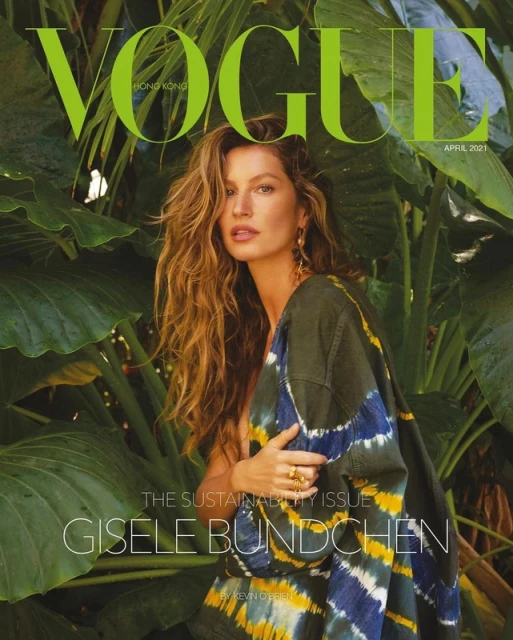 Vogue Hong Kong magazine cover featuring Gisele Bundchen surrounded by green tropical foliage with large text overlay, April 2021.