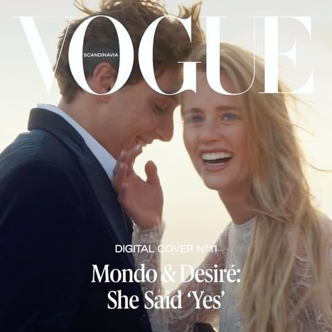 Vogue Scandinavia cover featuring a smiling couple. The woman has long blonde hair and is laughing. The man is in a dark suit and smiling.