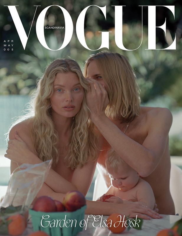 Vogue cover featuring two adults and a baby outside. The adult on the left has blonde hair, and the baby is in front.