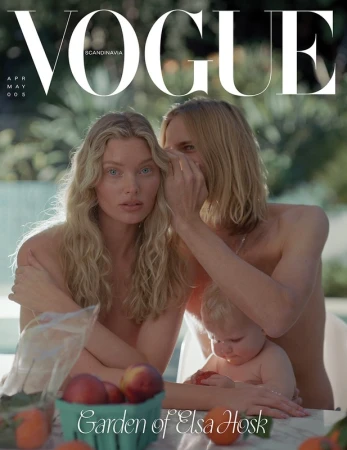Vogue cover featuring two adults and a baby outside. The adult on the left has blonde hair, and the baby is in front.