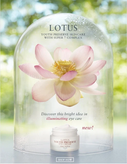 Lotus Youth Preserve eye cream jar and lotus flower under a glass dome, skincare advertisement with bright, natural light, and floral focus.