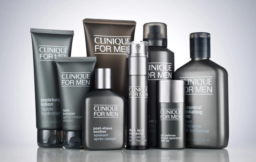 Clinique For Men product line featuring skincare items such as moisturizer, bronzer, post-shave soother, dark spot corrector, UV defense, and exfoliating tonic.