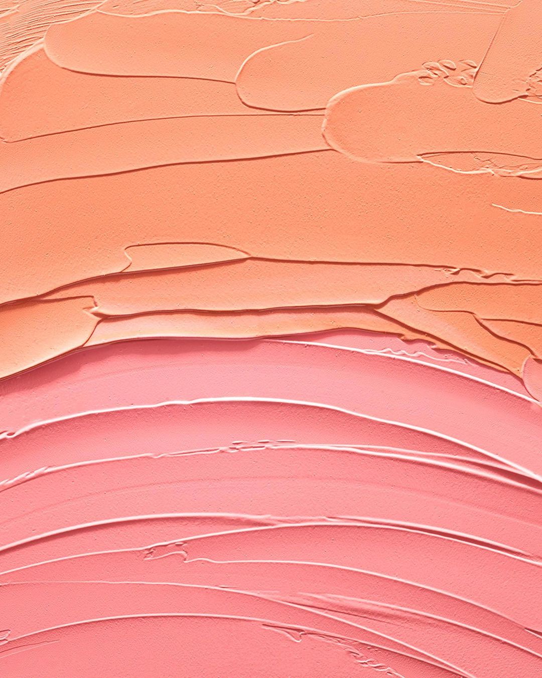 Close-up of pink and peach-colored abstract painting with a textured surface, horizontal brush strokes, and soft color blending.