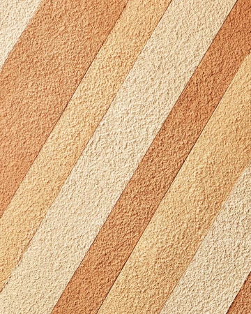 Abstract textured background with alternating diagonal stripes in shades of beige and brown, creating a visually appealing pattern.