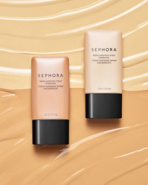 Two Sephora matte perfection tinted moisturizer bottles in light and medium tones, displayed on a background of beige foundation swatches.