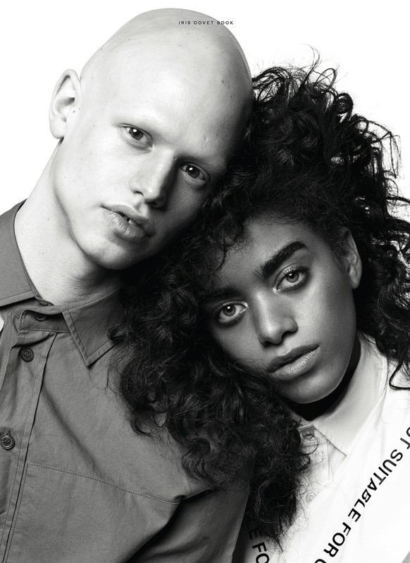 Portrait of two models with heads pressed together against a plain white background styled by Marc Anthony George.