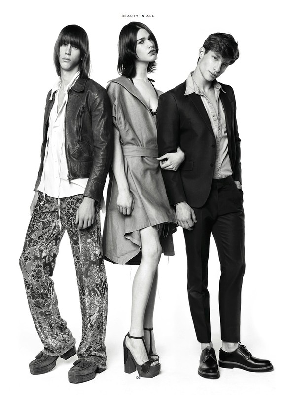 Three fashion models pose in a black-and-white studio shot. Two men and one woman showcase different styles with confident expressions.