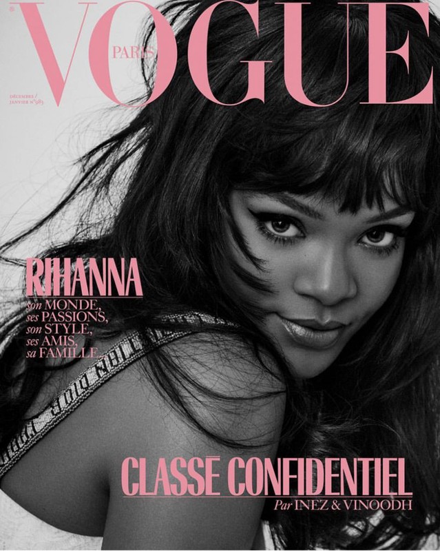 Vogue cover featuring Rihanna with black hair, wearing a Dior top.  Pink Vogue logo, with text "Classe Confidentiel par Inez & Vinoodh."