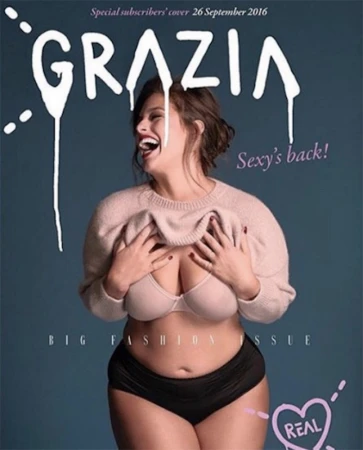 Magazine cover featuring plus-size model Ashley Graham wearing a beige sweater and black underwear against a blue background.