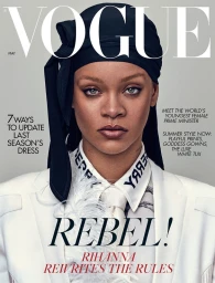 Portrait of Rihanna on a magazine cover wearing a black headwrap and white suit jacket with feather detail.