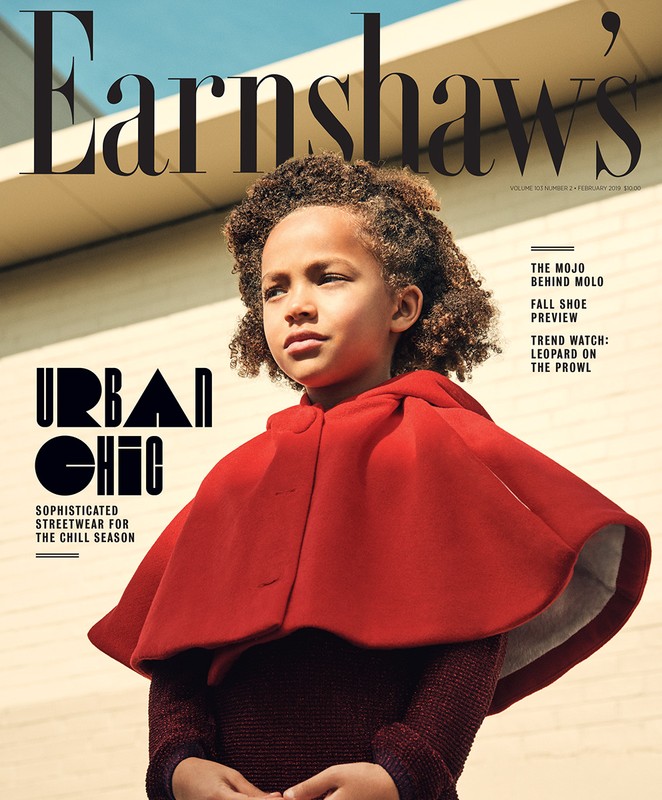 Magazine cover featuring a child model with curly hair wearing a red cape against a neutral outdoor backdrop. 'Earnshaw's' title visible.