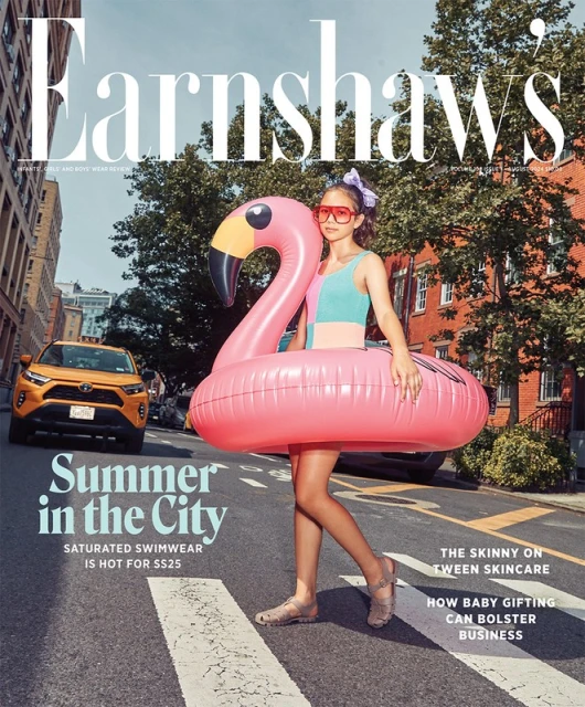 Magazine cover features a young girl with an inflatable flamingo on a city street with a passing taxi, promoting summer fashion.
