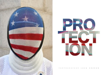 Fencing mask featuring an American flag pattern paired with white mesh apparel against a neutral background