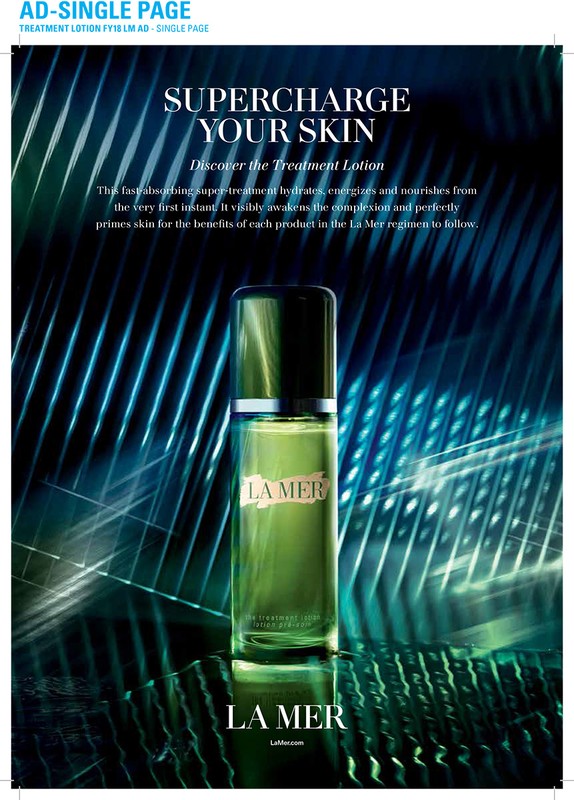 La Mer treatment lotion bottle on reflective surface with a teal and white abstract background in a beauty advertisement.