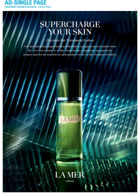 La Mer treatment lotion bottle on reflective surface with a teal and white abstract background in a beauty advertisement.