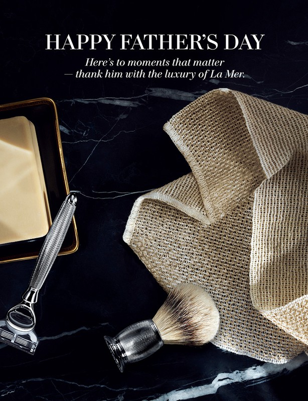 Father's Day promotion featuring razor, brush, and soap on a dark marble surface, creating a sophisticated grooming product display.
