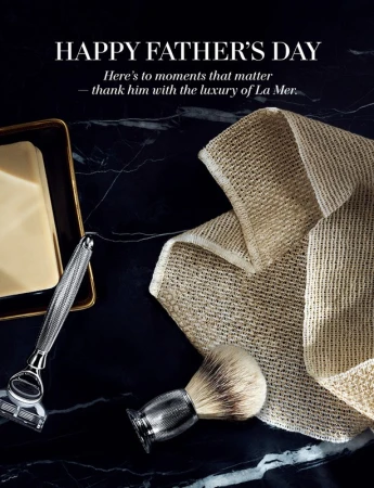 Father's Day promotion featuring razor, brush, and soap on a dark marble surface, creating a sophisticated grooming product display.