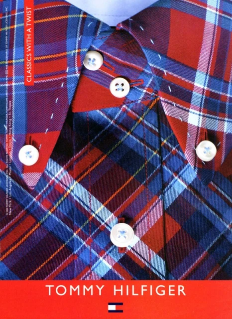 Close-up of a Tommy Hilfiger button-down shirt in a red, white, and blue plaid pattern, featuring white buttons and a light blue collar.