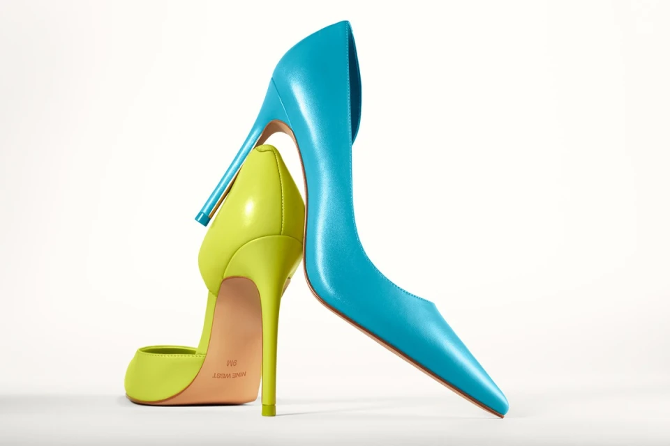 Turquoise and chartreuse Nine West high heels isolated on a white background, studio shot, fashion forward footwear.