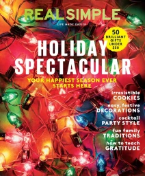 Close-up of tangled colorful Christmas tree lights glowing red, green, and yellow with holiday magazine text overlay