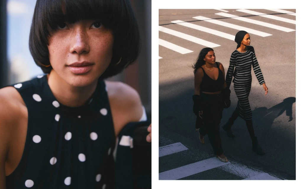 Two dark-haired women walk across a crosswalk on a sunny day, one in a black dress, one in a striped dress, with close-up studio portrait.