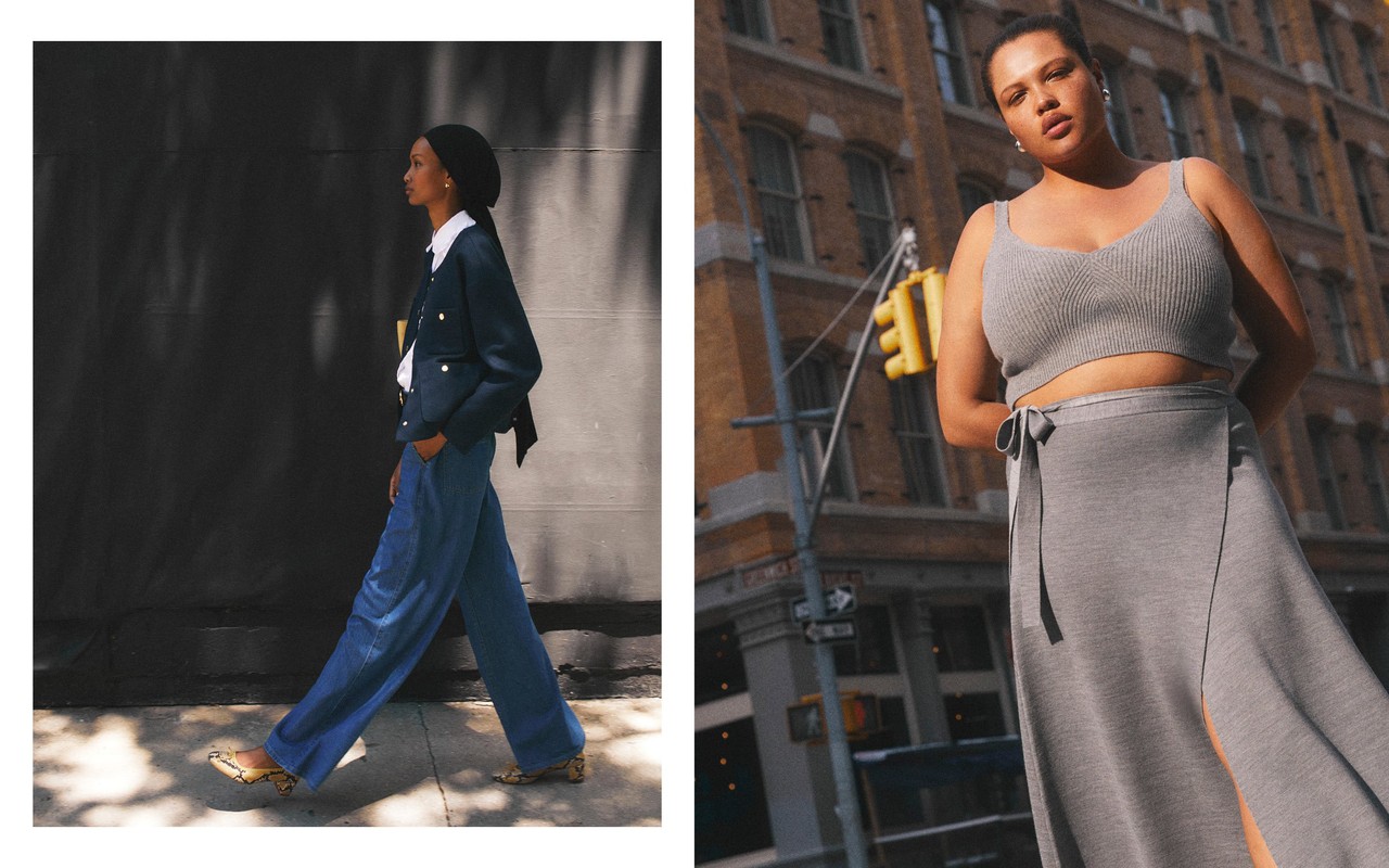 Two models showcase stylish, contemporary clothing on a city street with a traffic signal and architecture in the backdrop.