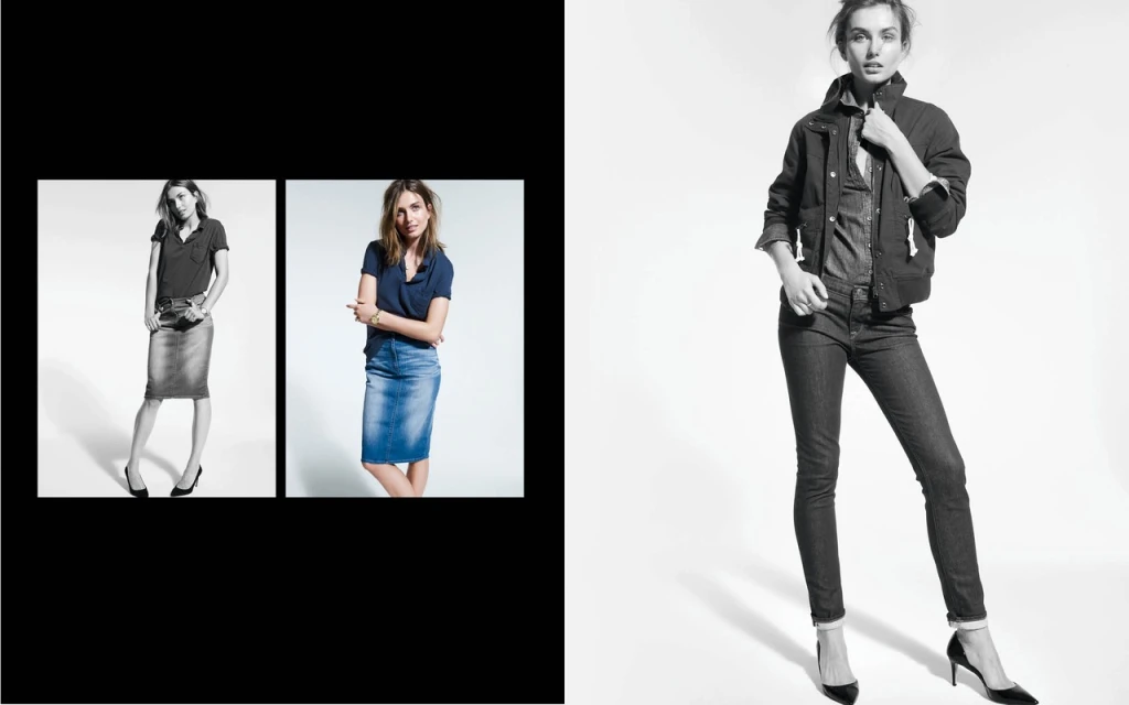 A woman poses in a studio, wearing a dark jacket, denim shirt, dark denim jeans, and black heels, presented in black and white.