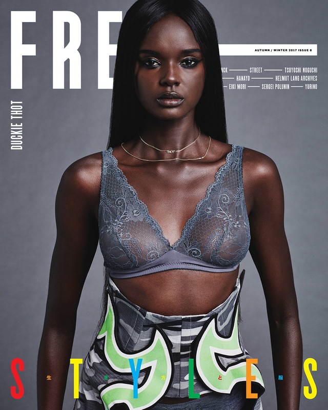 Magazine cover featuring a dark-skinned woman with long black hair, wearing a grey lace bra and a graffiti-style skirt with bright colors.