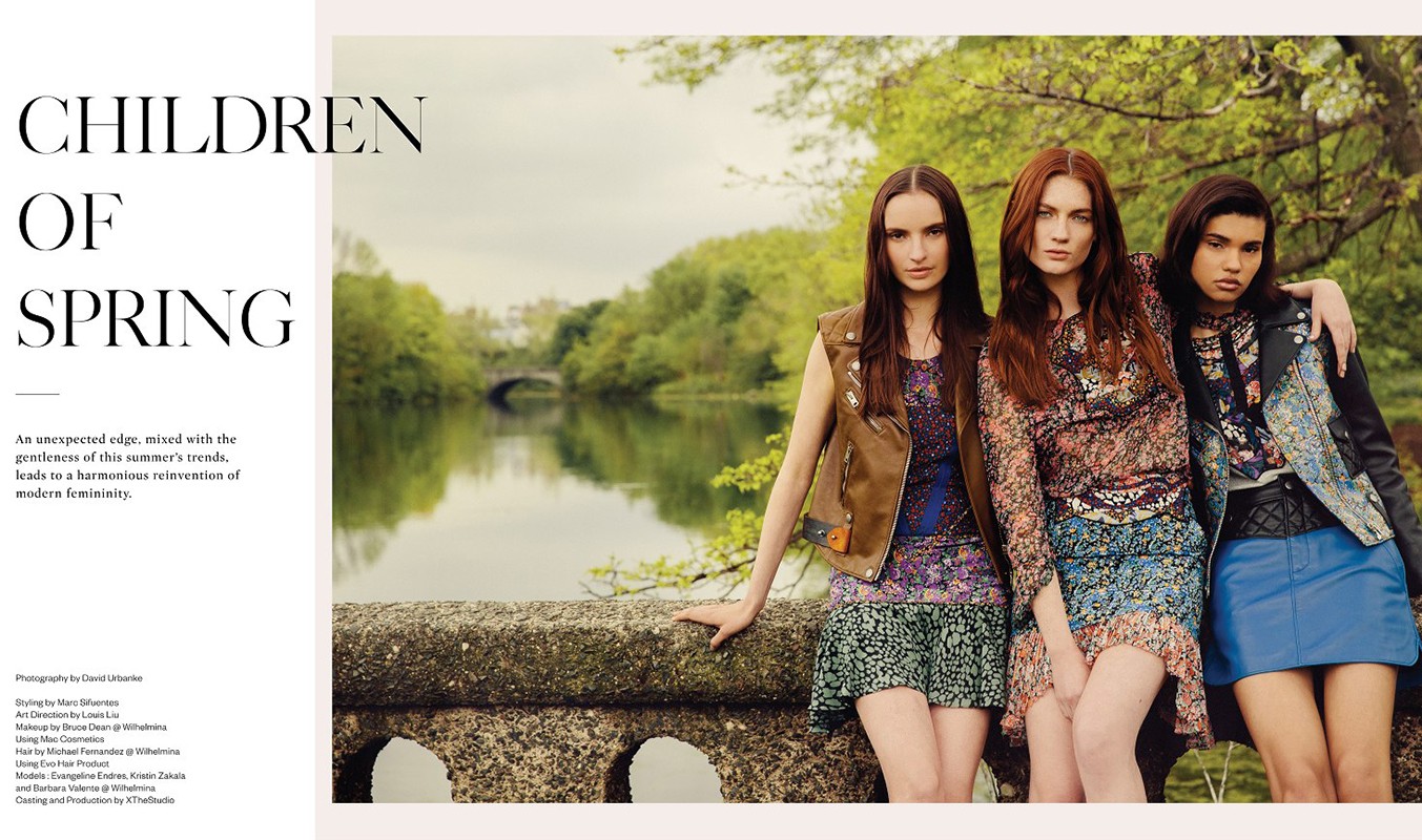 Three fashion models in outdoor setting with lake backdrop. Women wear dresses and stylish jackets. Spring fashion concept with natural light.