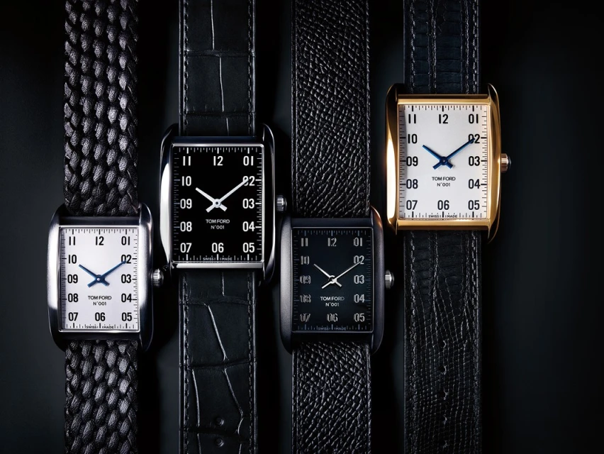 Four Tom Ford timepieces are displayed against a black background, showcasing a collection of luxury watches with unique straps and faces.