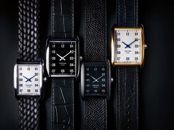 Four Tom Ford timepieces are displayed against a black background, showcasing a collection of luxury watches with unique straps and faces.