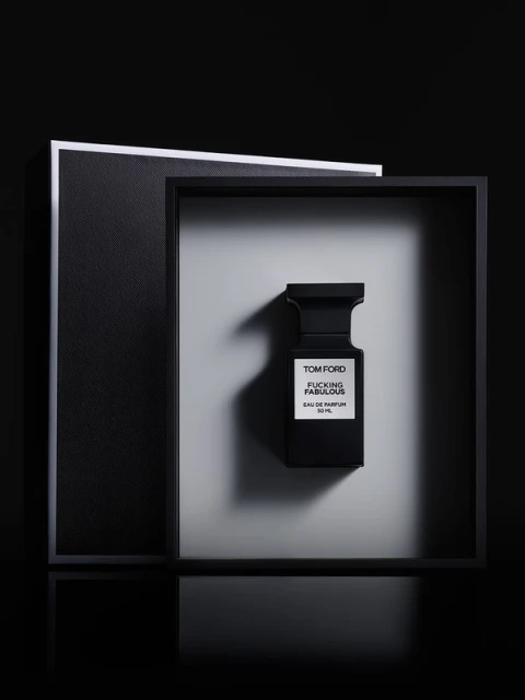 Tom Ford Fucking Fabulous perfume bottle in black and white studio setting with geometric frames, product shot for Beauty industry.