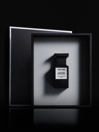 Tom Ford Fucking Fabulous perfume bottle in black and white studio setting with geometric frames, product shot for Beauty industry.