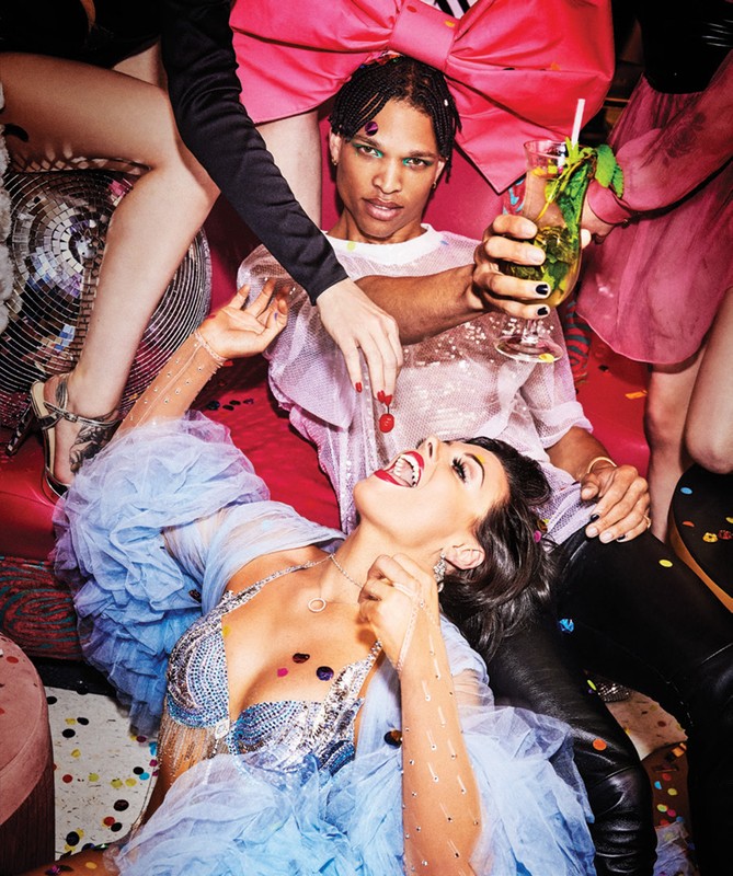Diverse group celebrates with cocktails, confetti, and a disco ball, captured in a vibrant, close-up shot perfect for party themes.