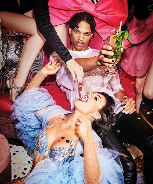 Diverse group celebrates with cocktails, confetti, and a disco ball, captured in a vibrant, close-up shot perfect for party themes.