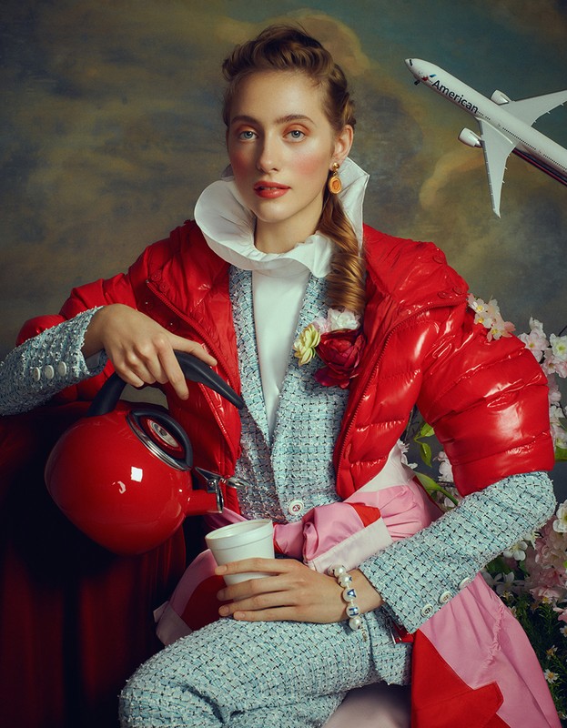 Woman in fashionable red puffer jacket and tweed suit pouring tea, with a toy airplane and floral elements in a painterly setting.