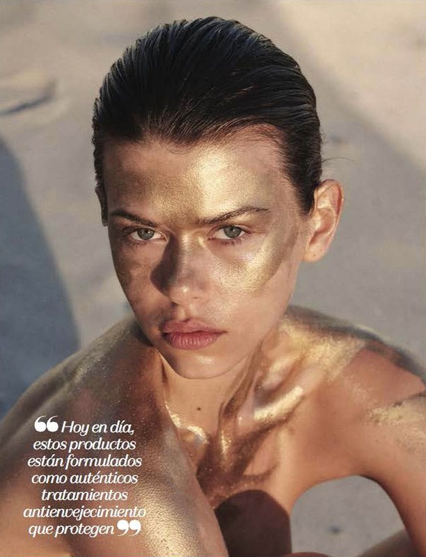Close-up of a woman with golden makeup and bare shoulders. The image highlights beauty and skincare with a focus on facial details.