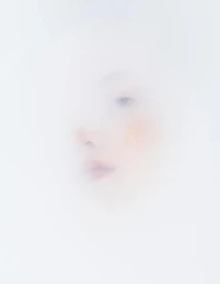 Close-up portrait of a woman's face partially obscured by a hazy white layer, featuring soft make-up by Nancy Sea Siler.