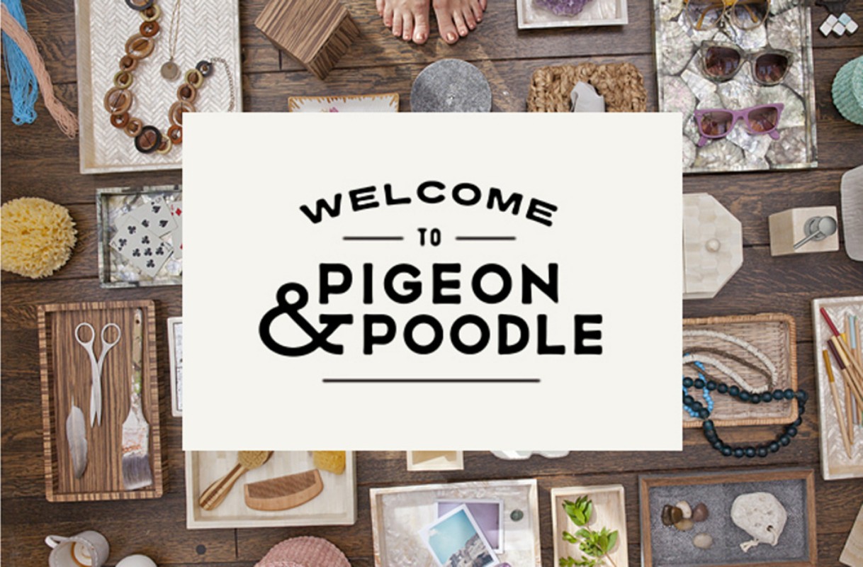 Overhead shot of assorted home decor items arranged on a wooden surface, featuring jewelry, eyewear, and cosmetic accessories.
