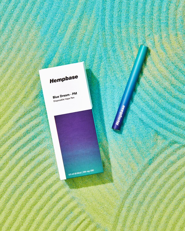 Hempbase vape pen and product box on an abstract blue and green background with an ombre effect and leaf-like textured pattern.