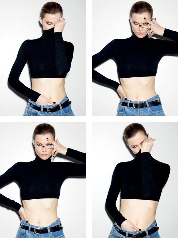 A woman in a black crop top and light wash jeans is posing against a white wall in a studio setting with a variety of poses.