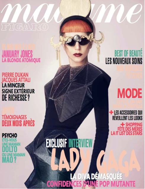 Lady Gaga on Madame Figaro magazine cover wearing ornate sunglasses, geometric black outfit against a light pink backdrop.
