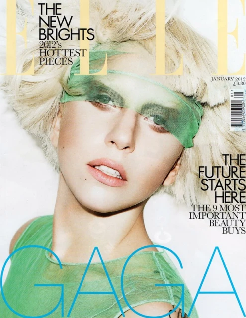 Close-up of Lady Gaga on an Elle magazine cover, January 2012 issue, with light blond hair, light green tulle eye covering and top.