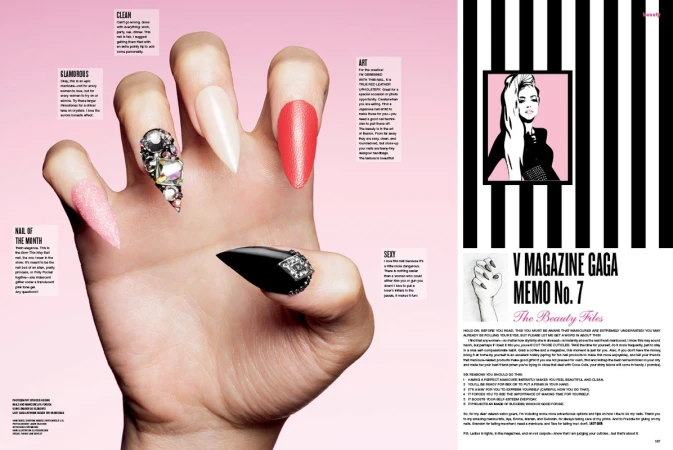 Close-up of a hand with long, decorated nails, showcasing various nail art designs and polished fingers against a pink background.